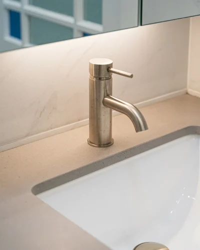 bathroom with exposed piping