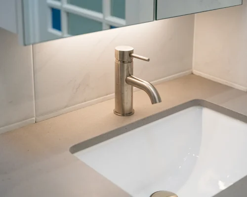 bathroom with exposed piping